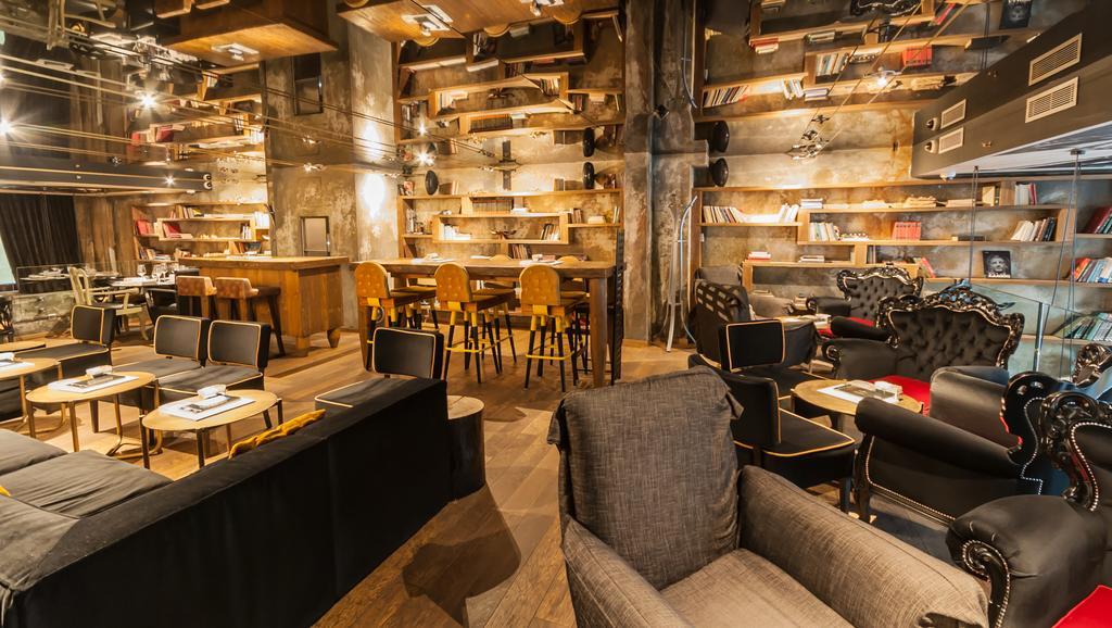 Hotel Hemera Podgorica Bagian luar foto Interior of a Starbucks Reserve store in Milan, Italy