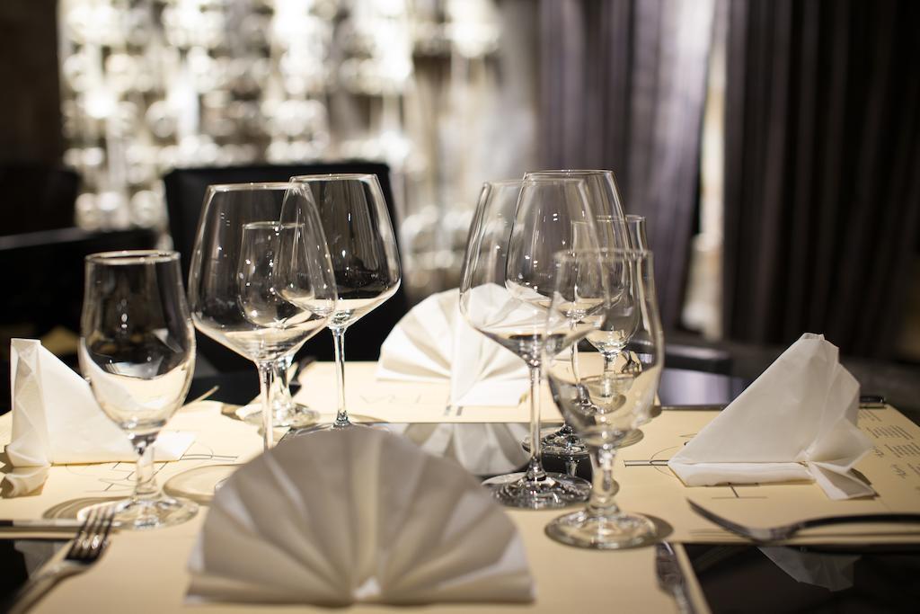 Hotel Hemera Podgorica Bagian luar foto A table set for fine dining